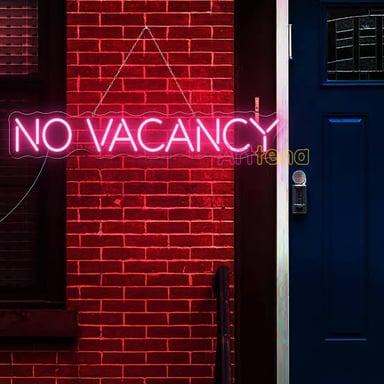 A vacancy sign displayed outside an inn.