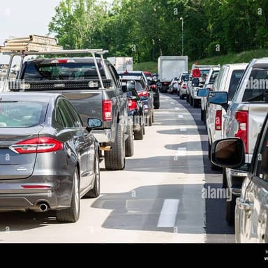 Cars stopped bumper to bumper in a traffic jam.