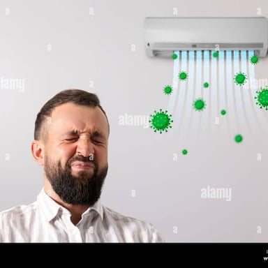 A person covers their nose while reacting to an unpleasant smell.
