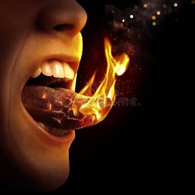 A narrow, elongated flame extending upward from a fire.