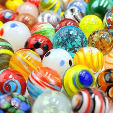 Colorful glass marbles gathered together.