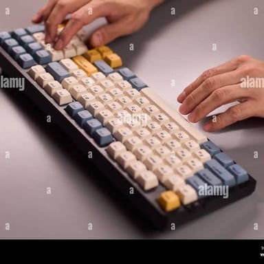 Hands pressing keys on a computer keyboard.