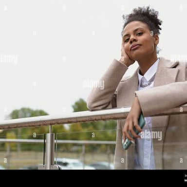 A person gazing into the distance with a wistful expression