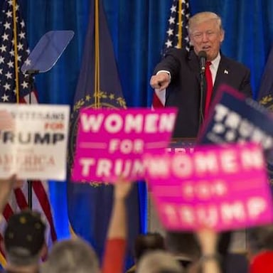 A political candidate speaking to supporters at a campaign rally.