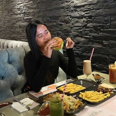 A person inspecting a meal carefully before eating it