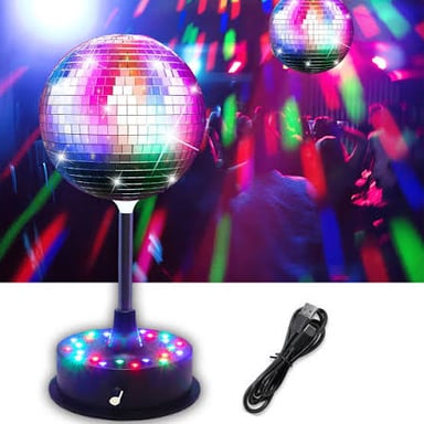 A spherical mirrored disco ball scattering light across a dance floor.