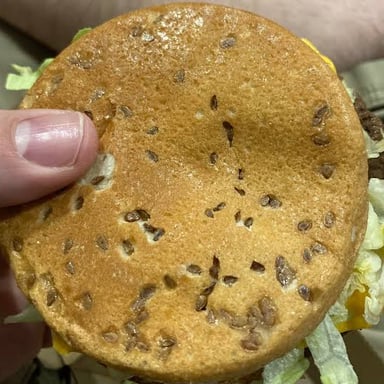 A Big Mac hamburger with its distinctive sesame-seed bun and layered filling.