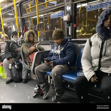 A passenger seated inside a city bus.