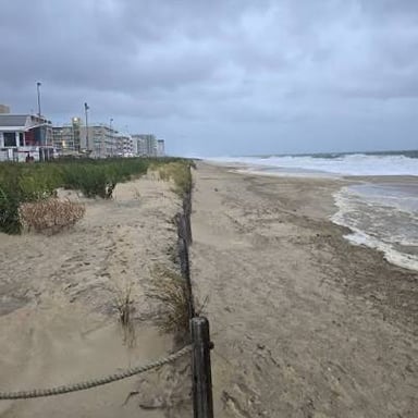 Water washing over a shoreline at high tide.