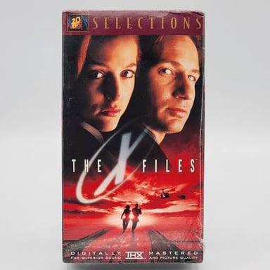 A flying object in the night sky, representing the UFO mysteries explored in The X-Files.
