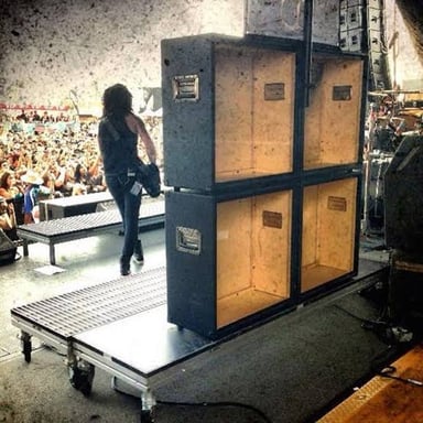 Amplifier cabinets on a concert stage, used to boost instrument sound.
