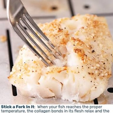 A fork separating cooked fish into flakes, the culinary meaning behind the phrase.