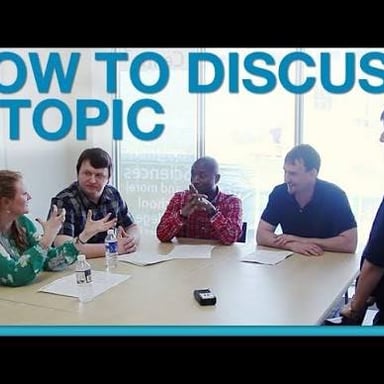 People discussing a subject, illustrating the meaning “as to” or “regarding.”