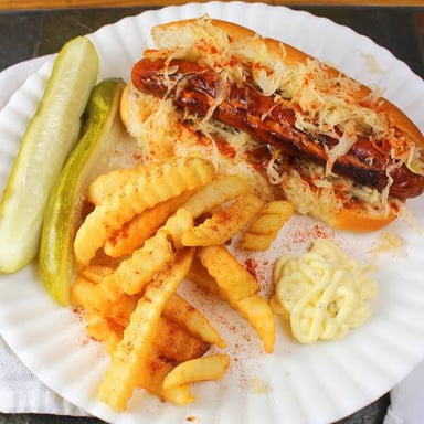 A frankfurter sausage served in a hot dog bun.