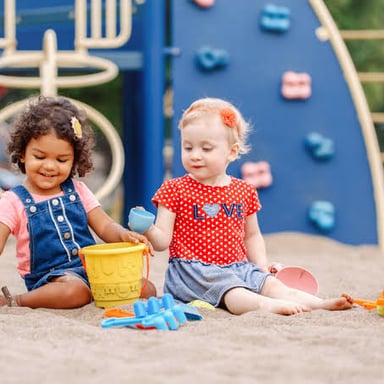 Several young children playing together.