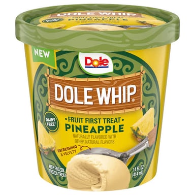 A serving of pale yellow pineapple soft serve in a cup.
