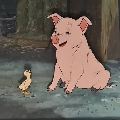 A young pig in a farm sty, the kind of enclosure where Wilbur lives in Charlotte's Web.