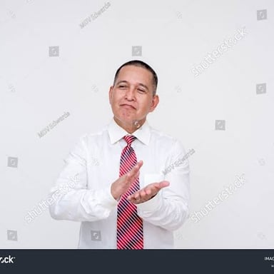 A person wearing a subtle amused expression
