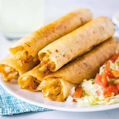 Crisp, rolled Mexican flautas served with toppings.