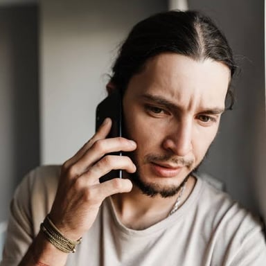 A person looking subdued, illustrating the mood described as feeling down.