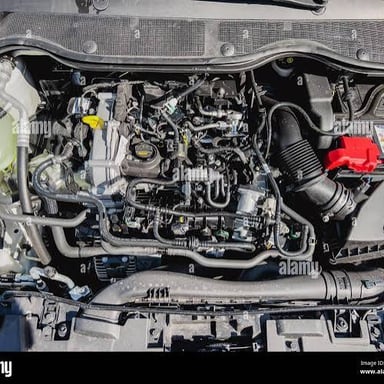 A car engine visible beneath an open hood.