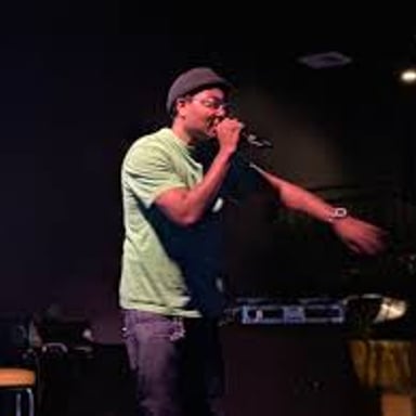 A DJ performs at a hip-hop event, illustrating the music genre.