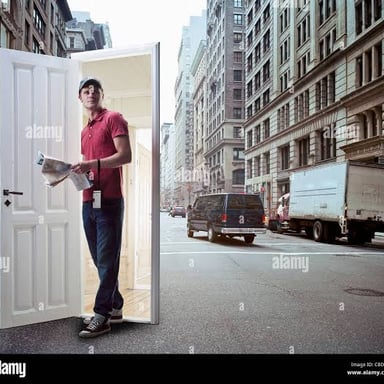 A person emerging through a doorway