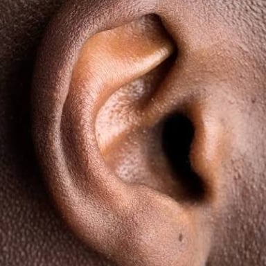 A close-up view of a human ear.