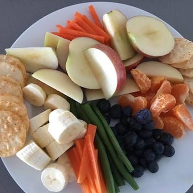 A meal set out for children, illustrating being fed.