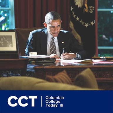 A government official working at a desk in a public office.