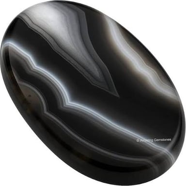 A polished onyx stone showing a dark surface and subtle bands.
