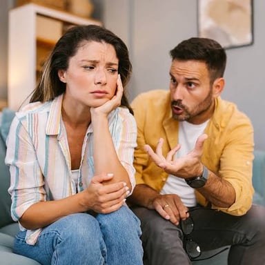 A person making a dismissive or critical gesture during a conversation