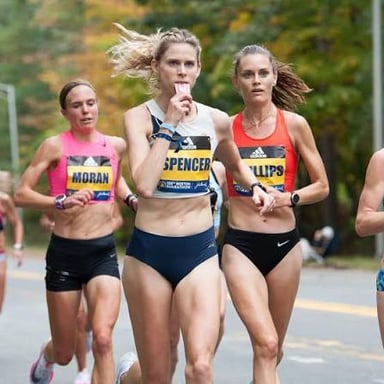 One runner leading a group along a route.