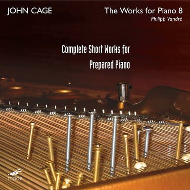 A prepared piano associated with composer John Cage, with objects altering the sound of its strings.