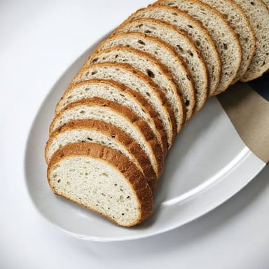 Slices of rye bread show caraway seeds scattered through the crumb.