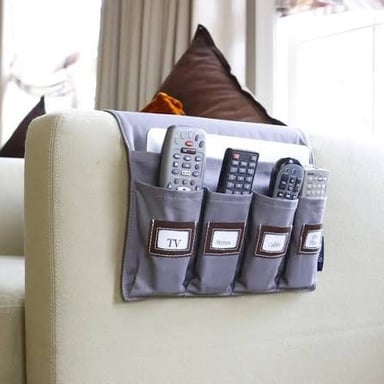 A sofa beside a television remote in a living room