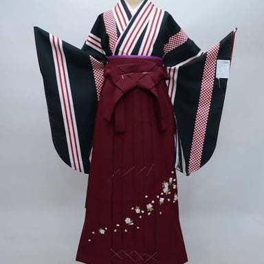 A Japanese furisode kimono fastened with a wide obi sash.