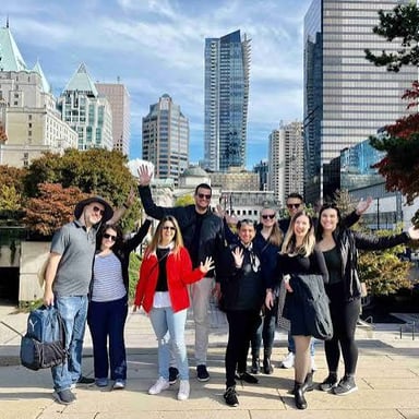 A group of sightseers following a guide on a city tour.