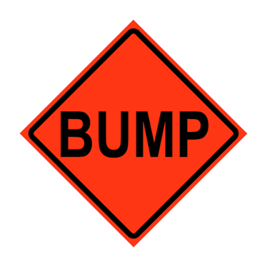 A collection of signs with the words EXIT, BUMP, STOP, and SLOW.