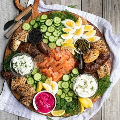 Slices of lox, or smoked salmon, arranged on a serving board.