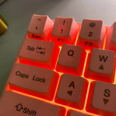 The Esc key at the upper-left corner of a computer keyboard beside the function keys
