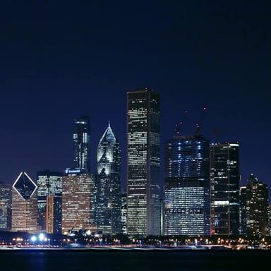 A city skyline at night representing an every-evening occurrence.
