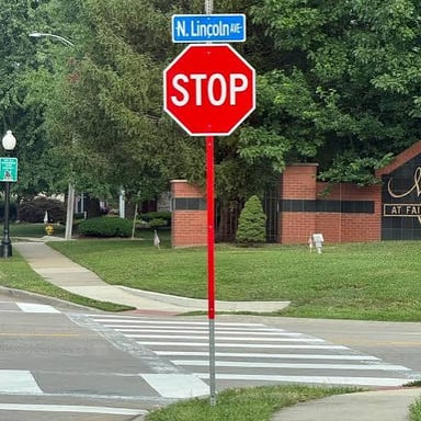 A red octagonal road sign displaying the word STOP.