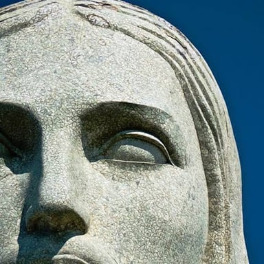 Christ the Redeemer overlooking Rio de Janeiro, with its tiled outer surface visible.
