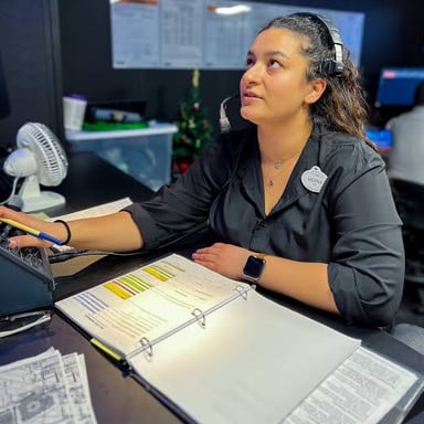A stage manager gives an offstage prompt during a theater performance.
