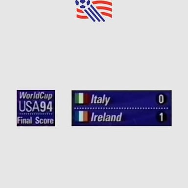 A football scoreboard displaying national flags beside teams' scores.