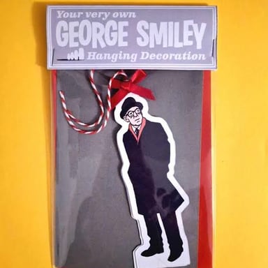 George Smiley, the fictional British intelligence officer created by John le Carré.