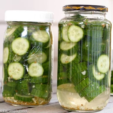 Pickles submerged in the salty brine commonly called pickle juice.