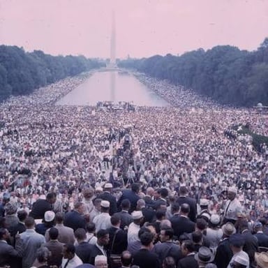 A crowd gathered in one place, illustrating a large number of people.
