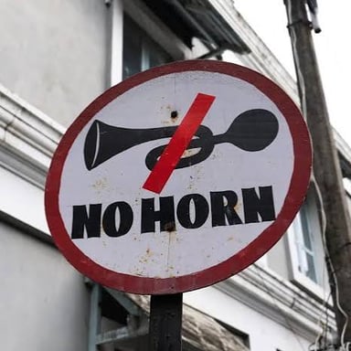 A car horn used to make a brief warning sound.